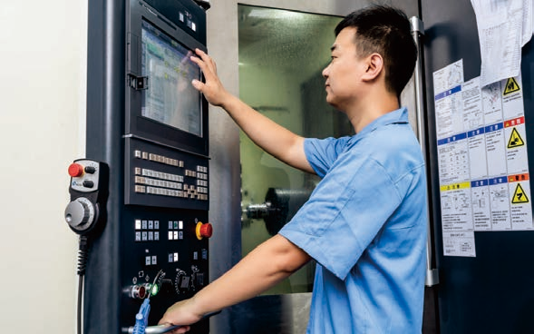 Skilled Worker Operating Machine in XY-GLOBAL Factory